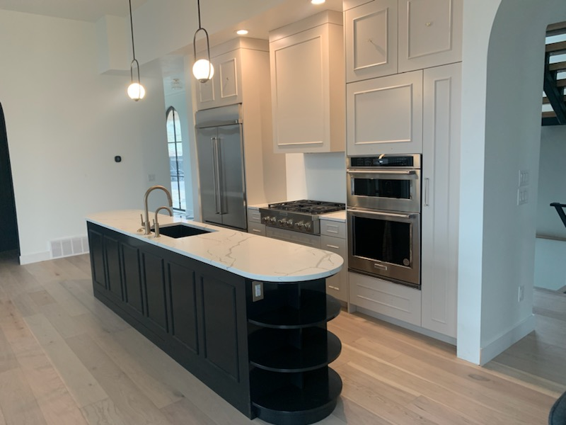 White kitchen with black island
