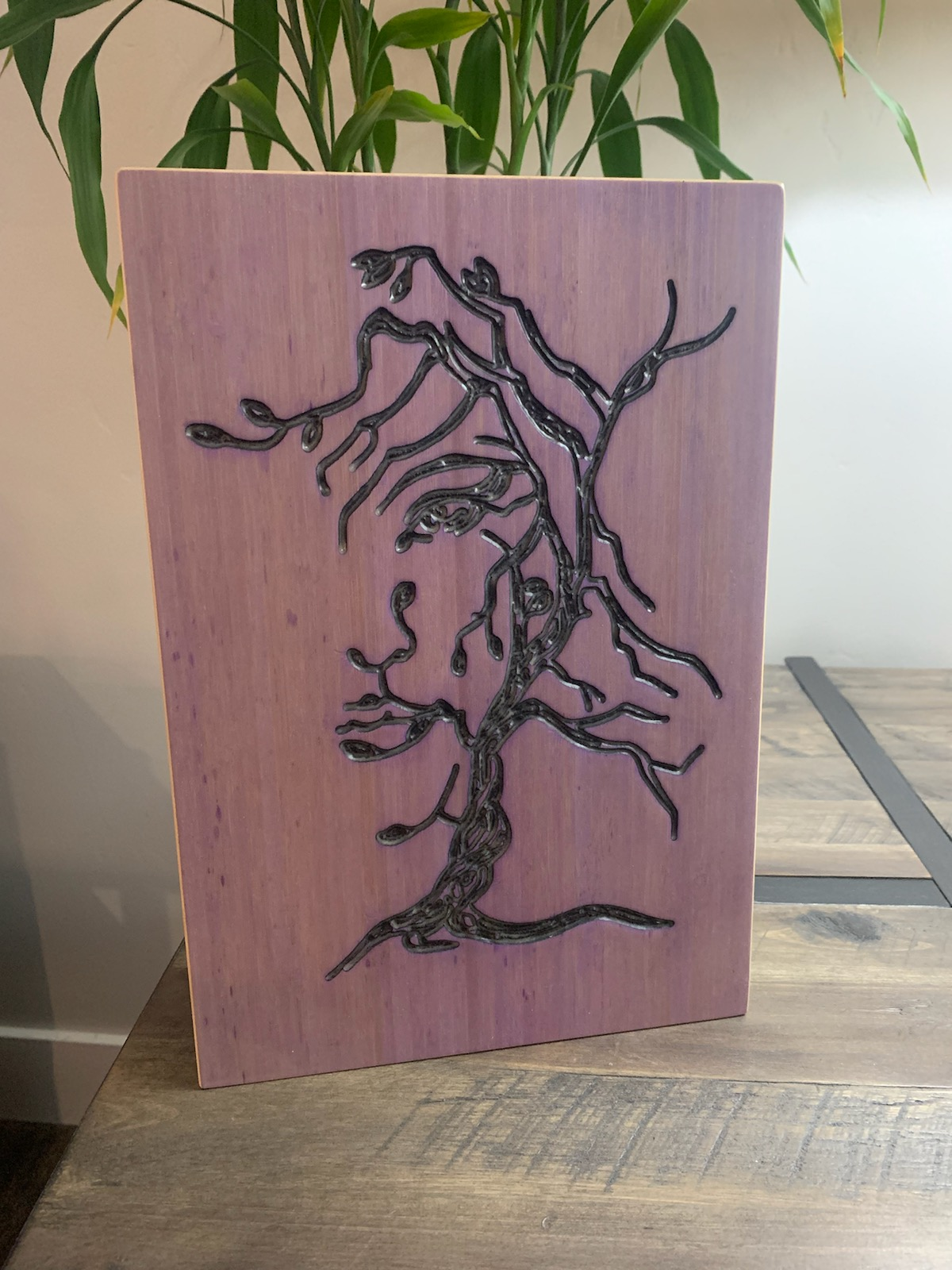 Hand-carved tree design wood panel, purple-stained with black relief carving